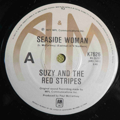 Suzy And The Red Stripes : Seaside Woman (7", Single)