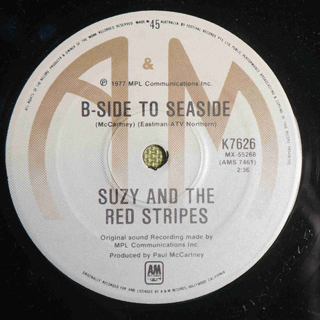 Suzy And The Red Stripes : Seaside Woman (7", Single)