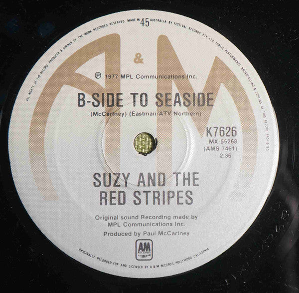 Suzy And The Red Stripes : Seaside Woman (7", Single)