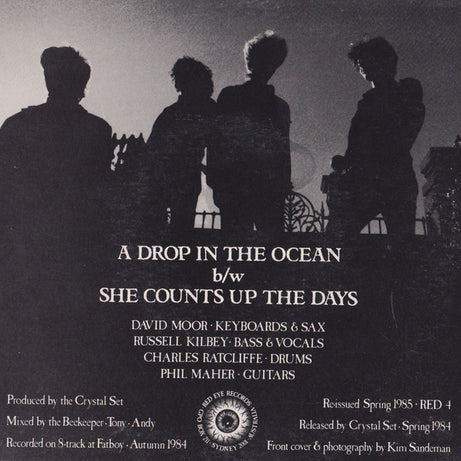 The Crystal Set : A Drop In The Ocean / She Counts Up The Days (7", Single, RE)